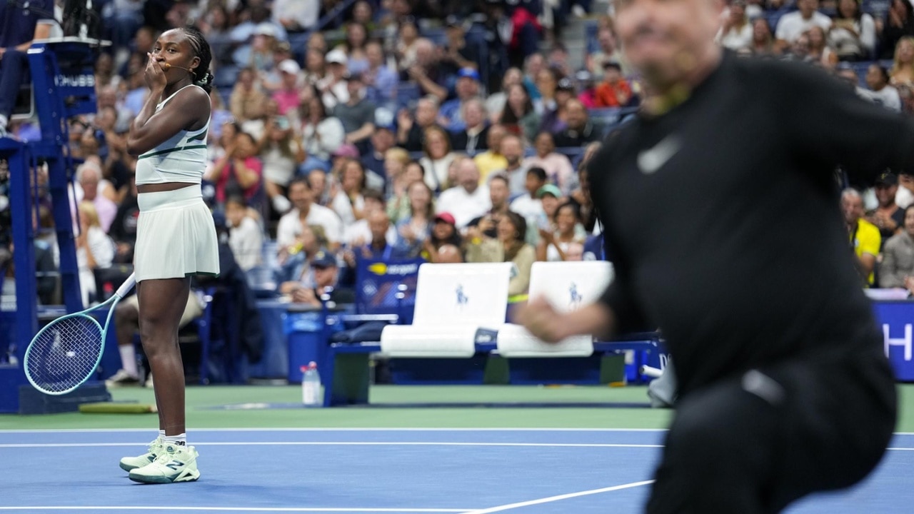 Coco Gauff reacts to the crowd during a Fan Week exhibition at the 2025 US Open