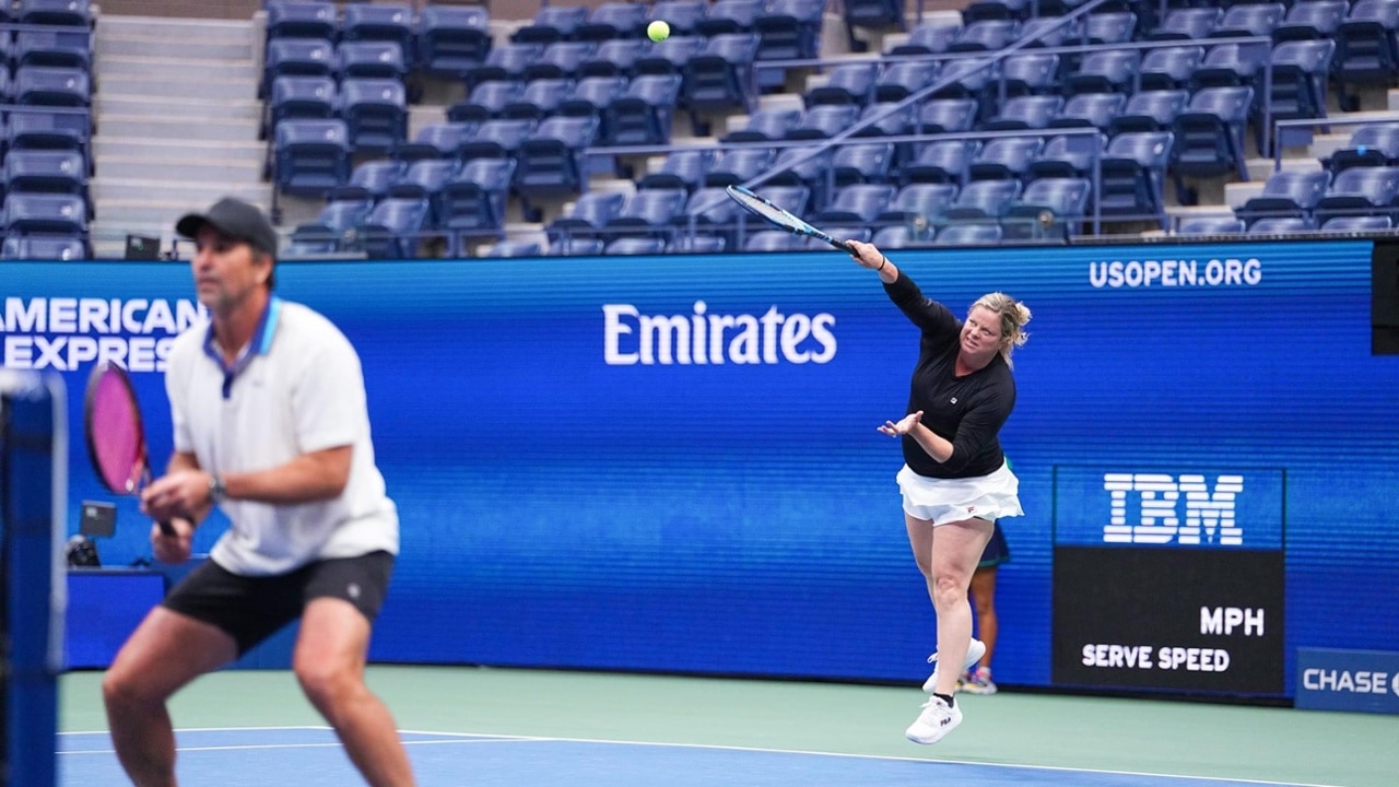 Kim Clijsters unleashes a smooth service motion during the exhibition