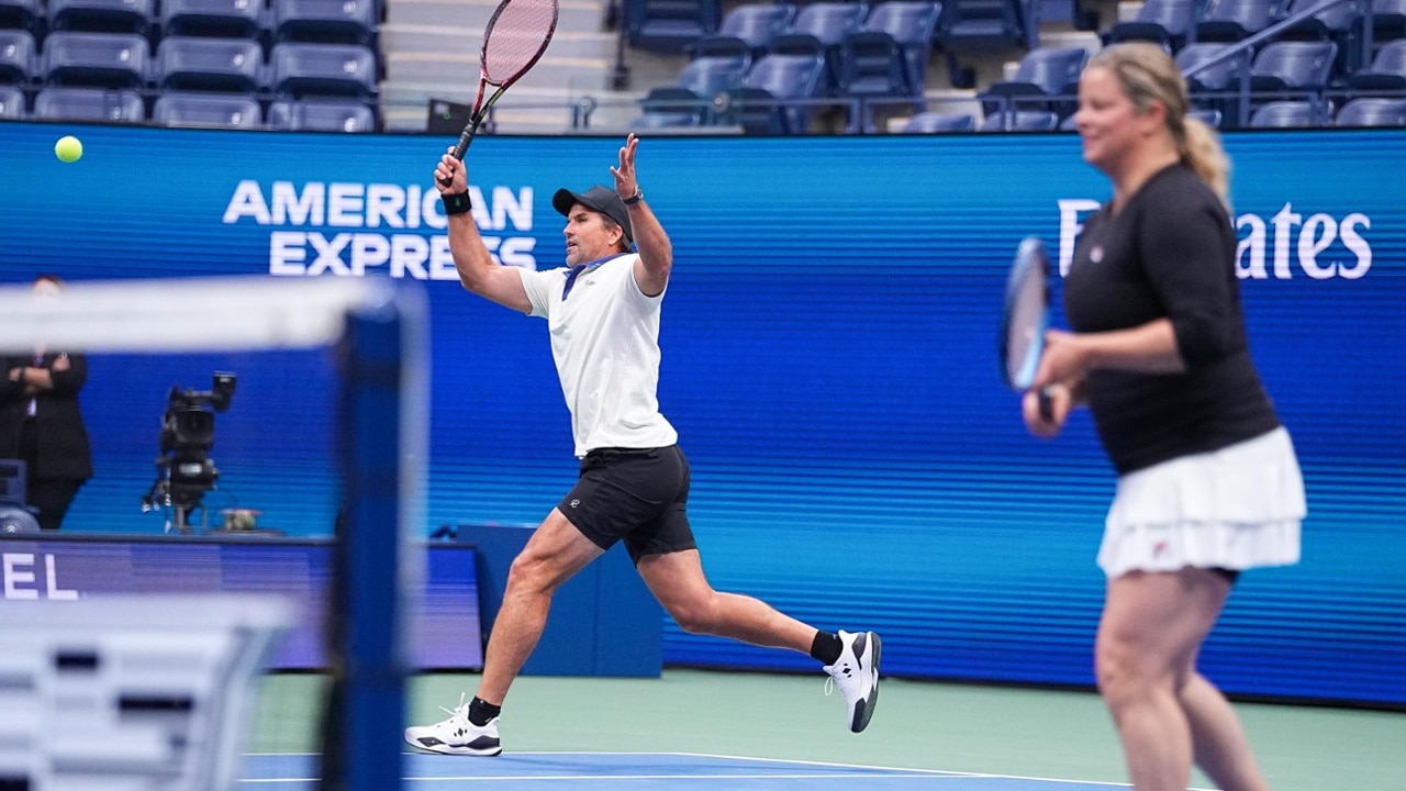 Patrick Rafter glides into a forehand approach, showcasing classic net-rushing instincts