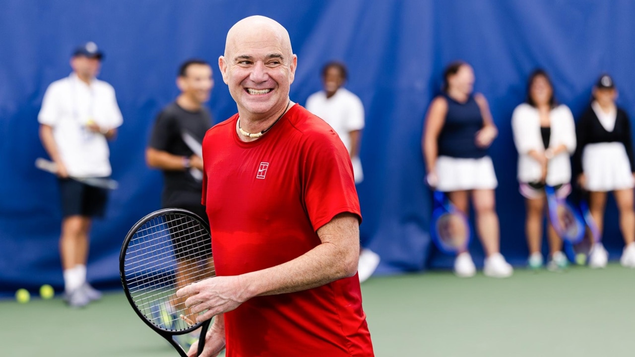 Andre Agassi engages with fans during a 'Play like a Pro' session at the 2025 US Open