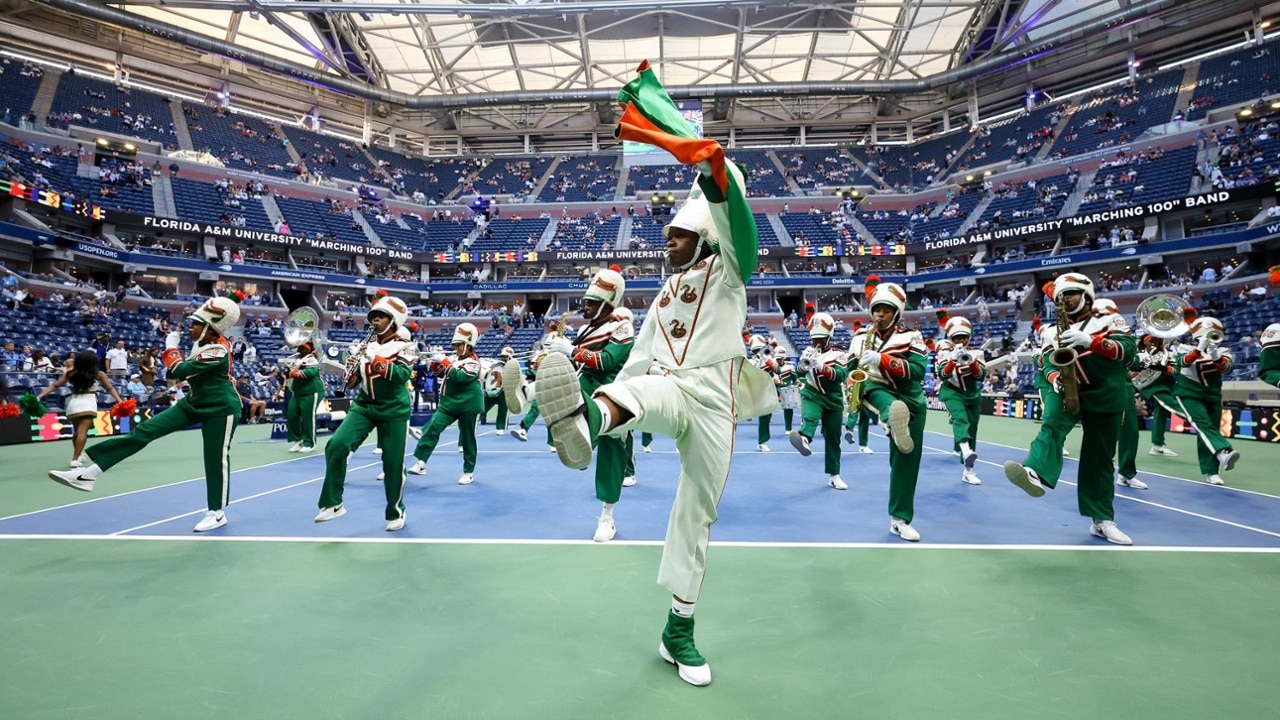 The Marching 100 from Florida A&M University fires up the crowd before a marquee men's match