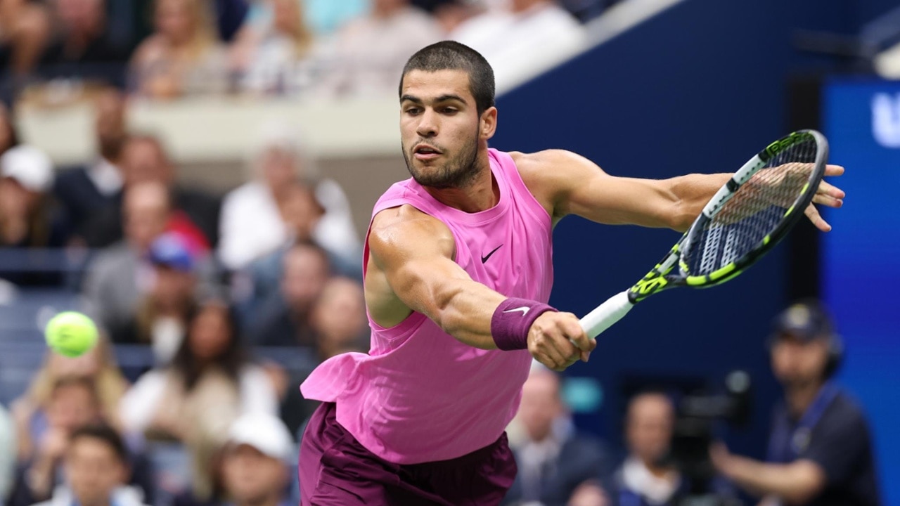Carlos Alcaraz drives a backhand in the championship match