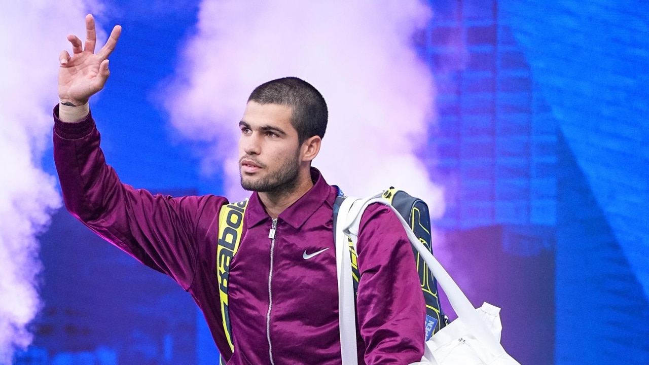 Carlos Alcaraz walks onto court for the men’s final