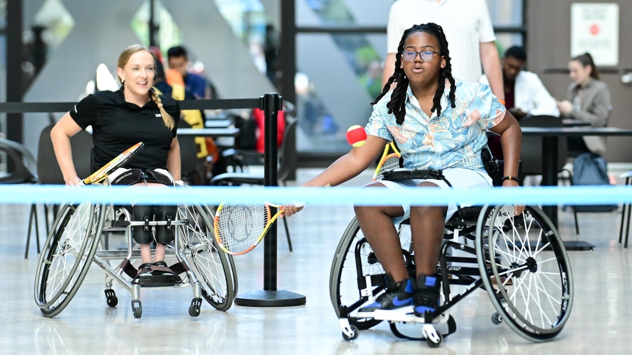 Participants try wheelchair tennis during a special activation at the 2025 US Open