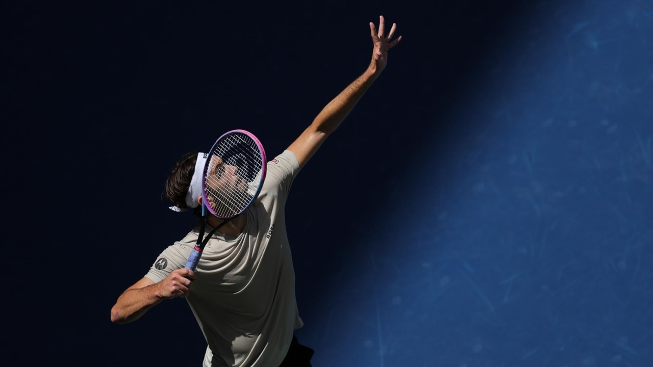 Taylor Fritz drives a flat serve into the corner