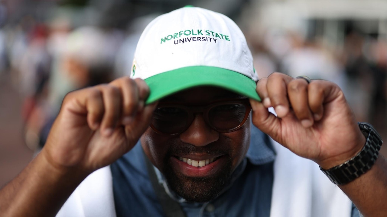 Capturing the moment: a fan snaps a photo during a live music set at the 2025 US Open